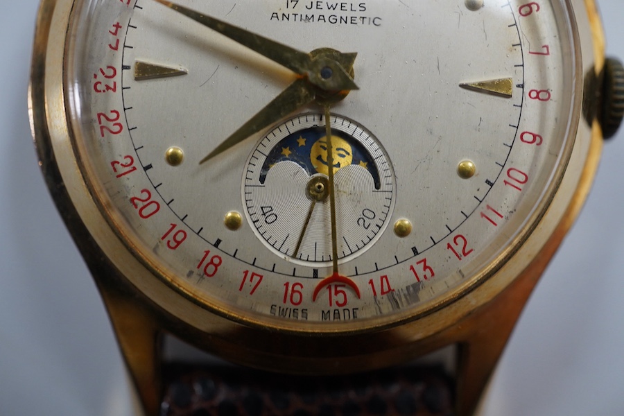 A gentleman's 1950's? steel and gold plated Oska Calendar Moonphase manual wind wrist watch, case diameter 32mm, on a later associated strap. Condition - poor to fair